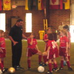 Tony DiCicco with the Academy girls