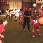 Tony DiCicco joins in with the Academy girls