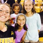 Young players enjoy the thrill of meeting a member of the Kennesaw State Owls women's soccer team