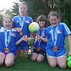 May 20, 2014: NASA Academy O'Hara were champions of their division. Because of weather, we had to delay the trophy / medal ceremony until later. Here are four members of team O'Hara proudly showing their medals and the Friendship Cup trophy.