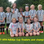 May 2017: Junior Academy Girls pose with their medals from the NTH Adidas Cup tournament.