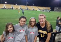 NASA Academy alumna Brittney Reed poses with current NASA Academy girls