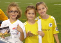Oct. 6, 2017 KSU vs Jacksonville game: NTH Junior Academy Girls smile after collecting player autographs